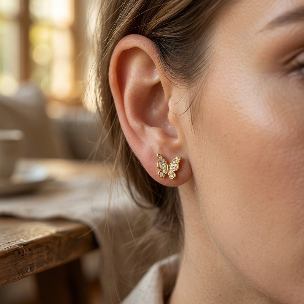 Model wearing Gold Butterfly Stud Earrings