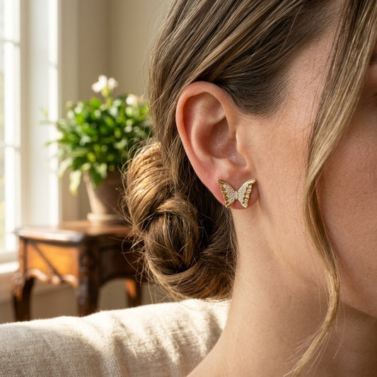 Model wearing Gold Butterfly Wing Stud Earrings